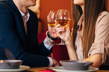 Happy young couple taking selfie with smart phone at cafe