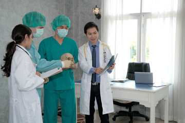 Doctors watching x-ray of patient