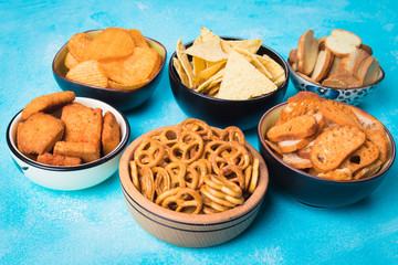 Salty snacks served in bowls