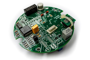 Closeup of electronic circuit board with CPU microchip electronic processor components  on withe...