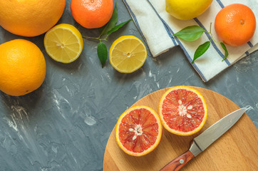 Fresh citrus fruits on table, top view.