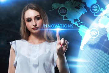 The concept of business, technology, the Internet and the network. A young entrepreneur working on a virtual screen of the future and sees the inscription: Innovations