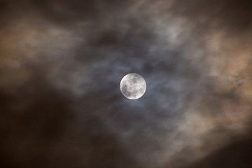 Naklejka na ściany i meble Cloudy full moon night.