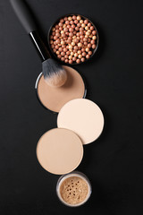 Set of various face powder and brush