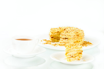 cup of tea, puff homemade cake with custard and biscuit crumb