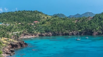 Fototapeta na wymiar Guadeloupe, panorama of the Saintes islands, sailboats in a beautiful bay 