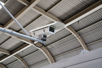 CCTV Camera security operating on subway station platform, underground railways station.