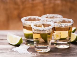 Tequila shots with lime fruits and salt 