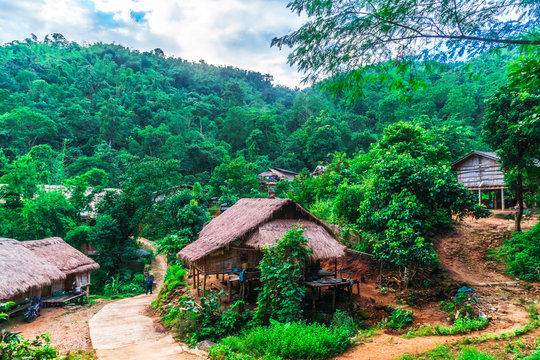 View on traditional bamboo village of Yao tribe in the mountains by Chiang Rai - Thiland