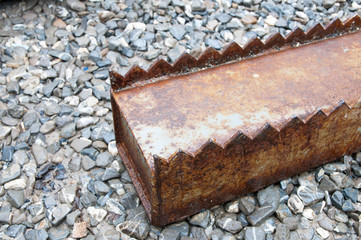 Rusty iron industrial sheet glass storage column close up shot on natural light.