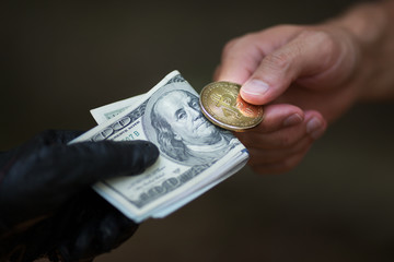 Black market concept,bitcoin and US dollar in hands