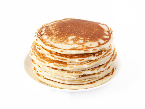 Golden pancakes / Pancakes with plate on a white background