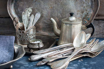 Vintage old utensils made of nickel silver, tableware (kettle, teaspoons, tablespoons, knives,...