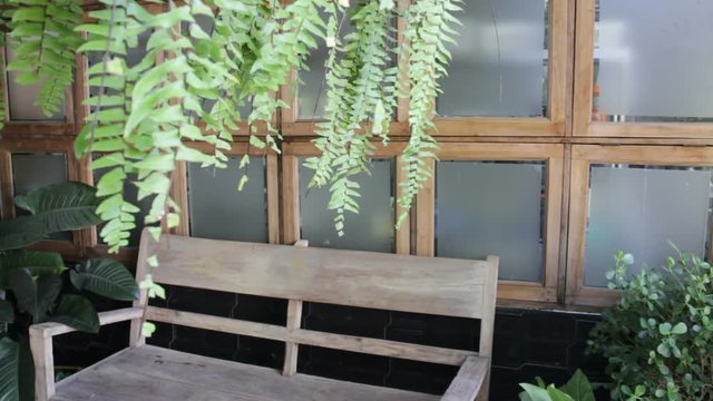 Wooden bench seat in home garden, stock footage