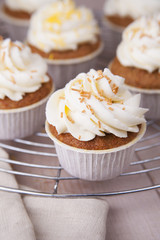 Carrot cupcakes/ Cupcakes with cream cheese  cream on a metal stand