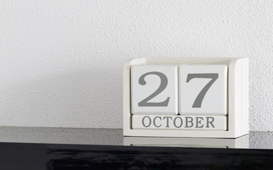 White block calendar present date 27 and month October