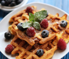 Traditional belgian waffles with fresh berrys and sugar powder  