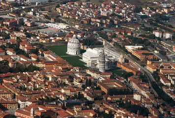 Magnificent view from the plane to the center of Pisa and the square with the falling tower in clear weather