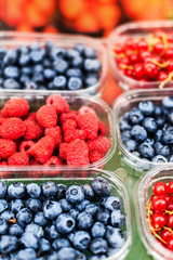 Various berries from a local farmer market.  Healthy local food market concept. 