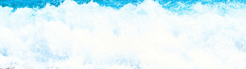 Soft wave of blue ocean on sandy beach Background with place for text. 