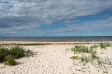 Fototapeta na wymiar Sandy beach at gulf of Riga, Baltic sea.