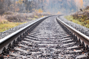 Fototapeta premium Soft blur photos taken on the soft lens. Railroad in autumn stretches into the distance.
