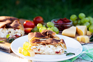 Strudel with cheese and sun-dried tomatoes.
