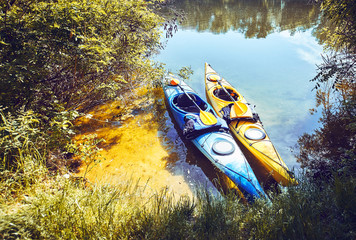 A summer walk along the river on kayaks on a sunny day.