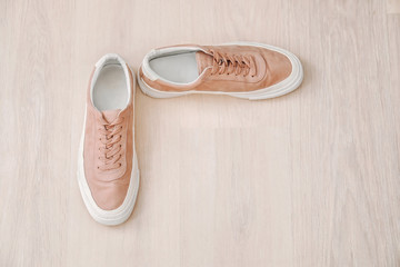 Casual male shoes on wooden floor