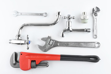 Plumber's items on white background