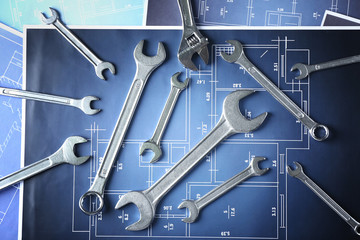 Plumber's tools on blueprint
