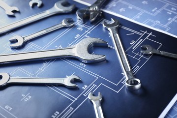 Plumber's tools on blueprint