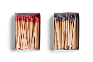 Top view of opened match boxes with burned matchsticks. Isolated on white background