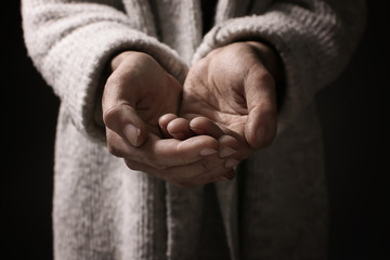Poor woman begging for money, closeup