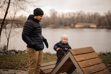 Father walking with a little son in the park