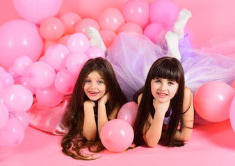 Young girl at a studio with pink balloons