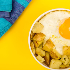 Fried Egg With Fried Potatoes In A Bowl