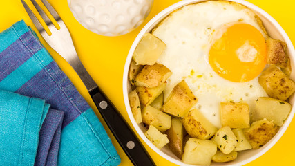 Fried Egg With Fried Potatoes In A Bowl