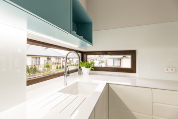Windows in white kitchen interior