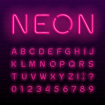 Neon lamp alphabet font. Neon color shiny letters, numbers and symbols. Brick wall background. Stock vector typeface for any typography design.