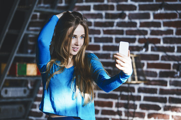 Beautiful young woman successful fashionable and beautiful with mobile phone in hand
