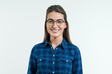 Portrait of young positive woman with long straight hair, blue eyes and an attractive smile, posing in the studio on white background.