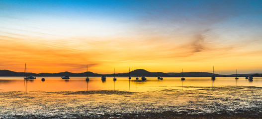 Dawn Waterscape over the Bay with Boats