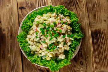 Salad with crab sticks, sweet corn, cucumber, eggs, rice and mayonnaise