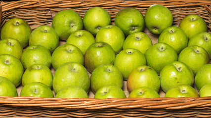 Bunch of green apples in supermarket