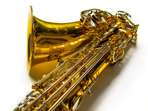 Old golden saxophone close-up.
Beautiful vintage shiny brass jazz musical instrument.