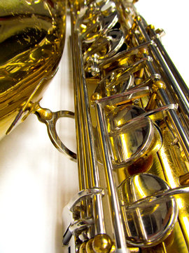 Old golden saxophone close-up.
Beautiful vintage shiny brass jazz musical instrument.