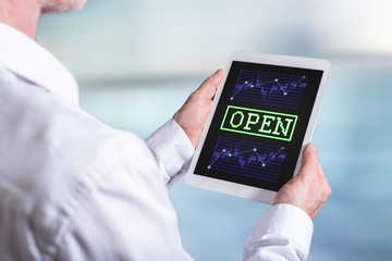 Open stock market concept on a tablet