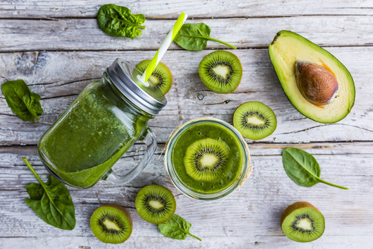 A delicious and healthy green smoothie in mug jar. 