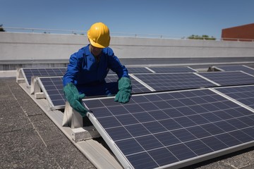 Male worker working at solar station